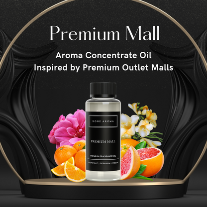 Hone Aroma Premium Mall Essential Aroma Oil bottle with fresh citrus and floral ingredients on black background